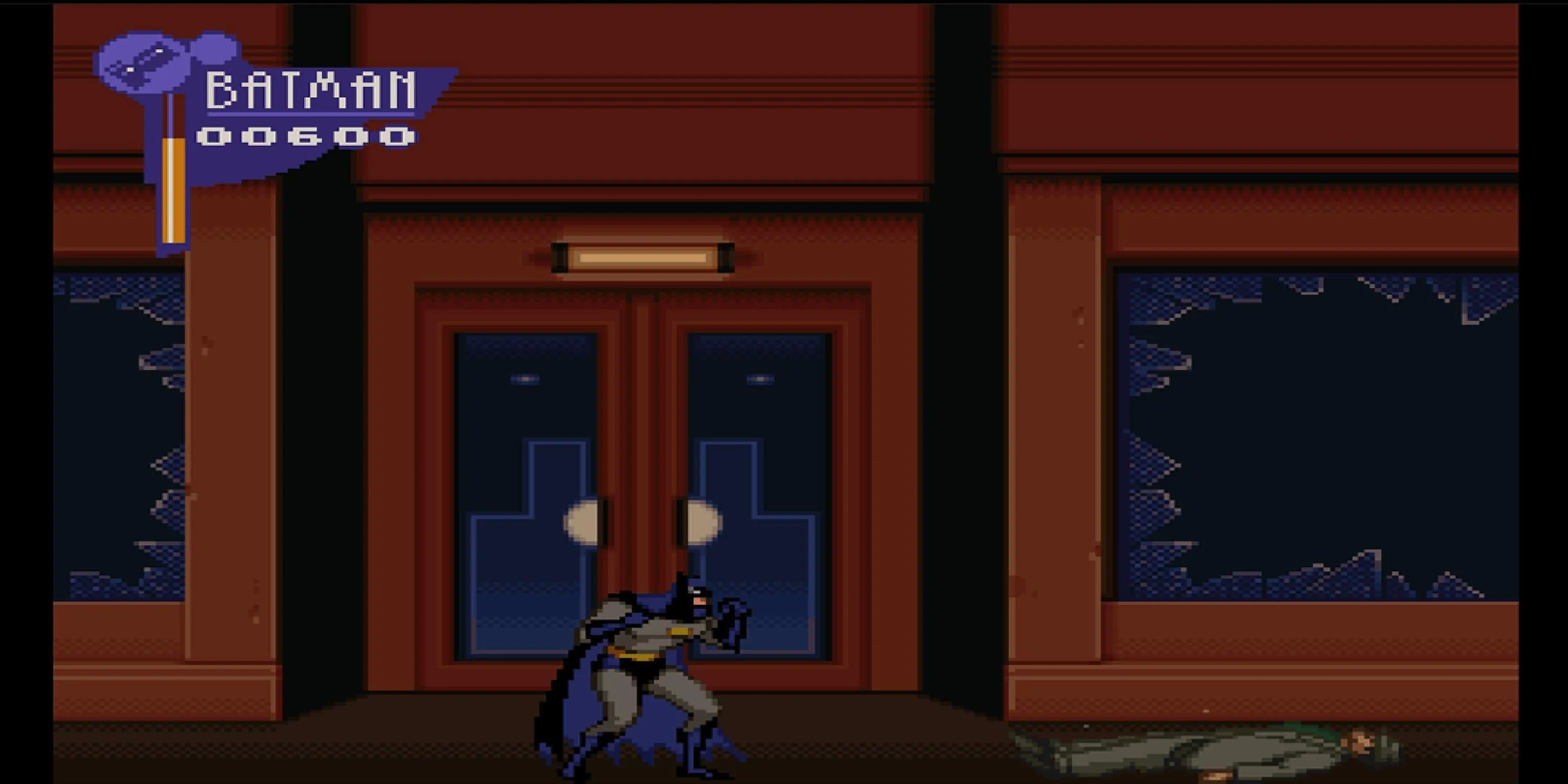 Batman đứng sau khi chiến đấu với kẻ thù trên đường phố trong The Adventures of Batman and Robin