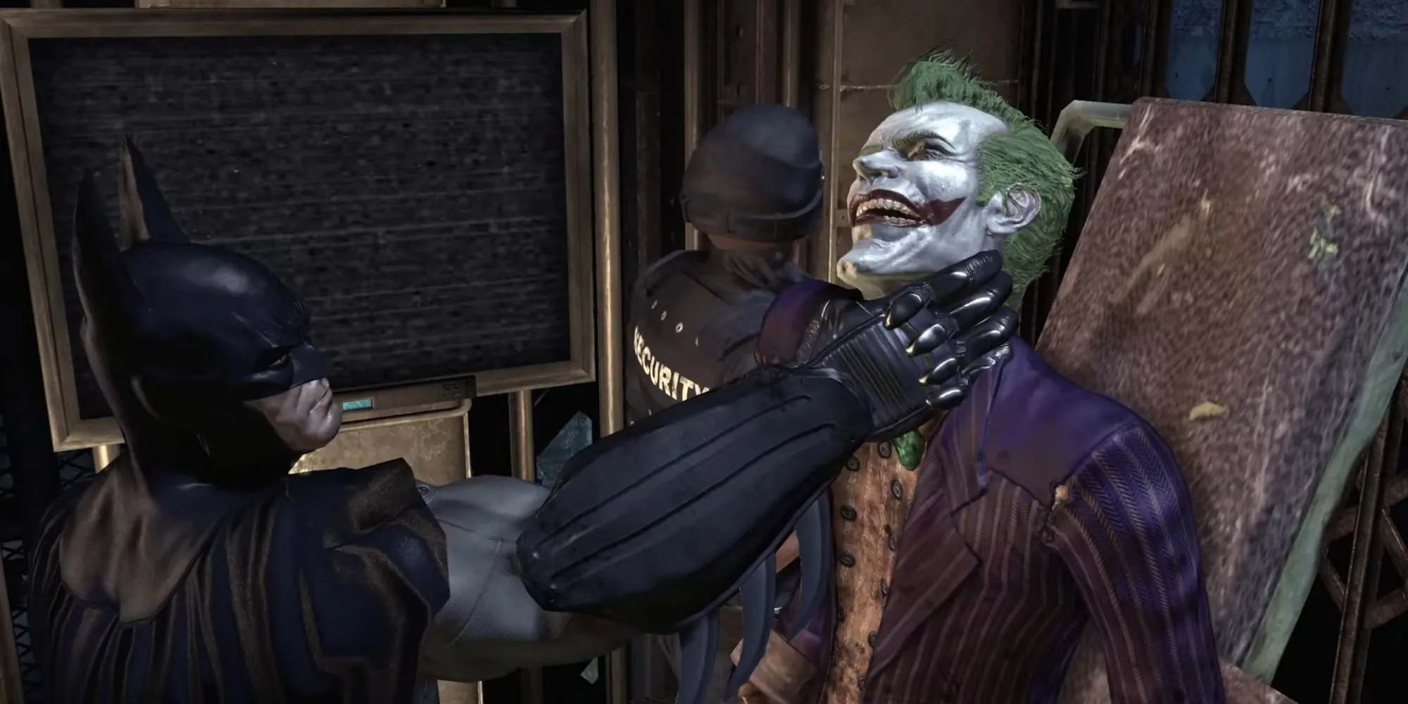 Batman giữ Joker trong trạng thái bị vận chuyển đến phòng giam trong Batman Arkham Asylum