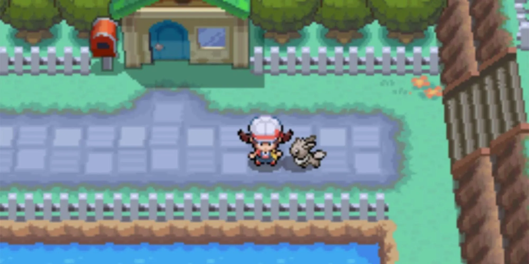 Huấn luyện viên Pokemon đứng cùng Eevee trong một khung cảnh yên bình của Pokemon HeartGold